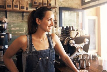woman in a coffee shop smiling