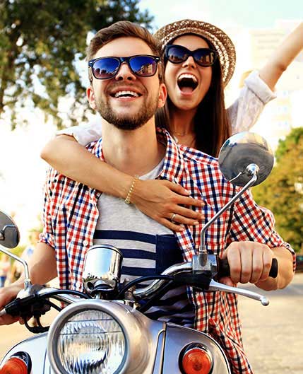 young couple on a motorcycle