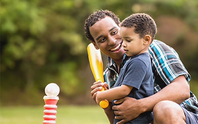 Father and son playing baseball