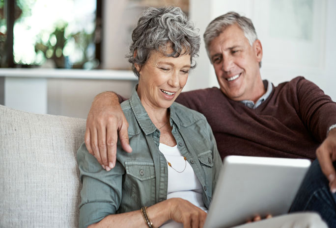 Senior couple viewing tablet