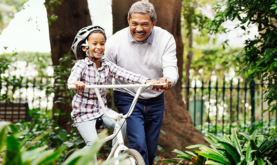grandpa and granddaughter riding bicycle